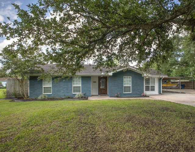 5269 Fairview Dr, Orange, TX 77630 - ranch-style house with a carport, a front lawn, and concrete driveway