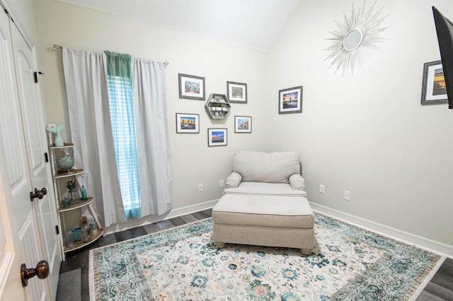 sitting room featuring hardwood / wood-style floors and lofted ceiling