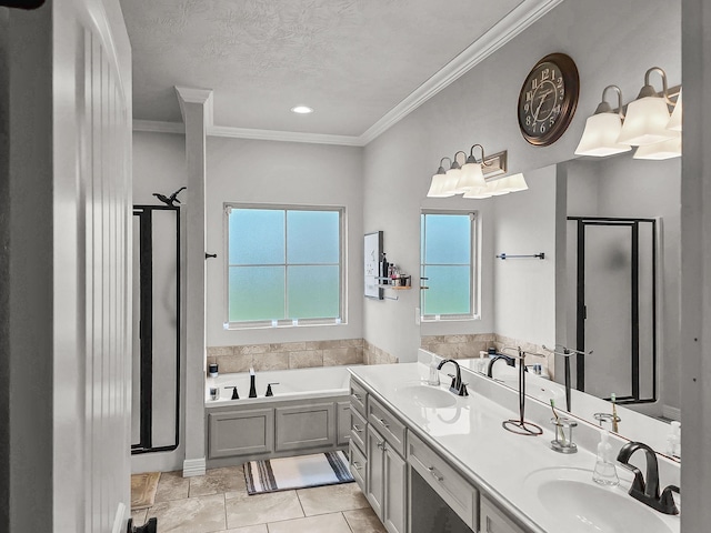 full bath with ornamental molding, a shower stall, a bath, and a sink