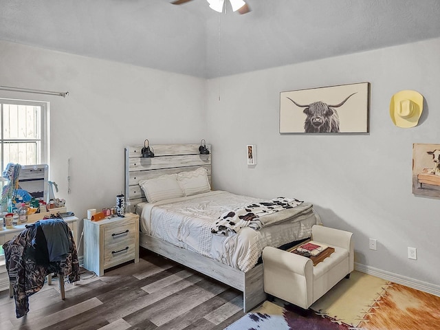 bedroom with wood finished floors and a ceiling fan