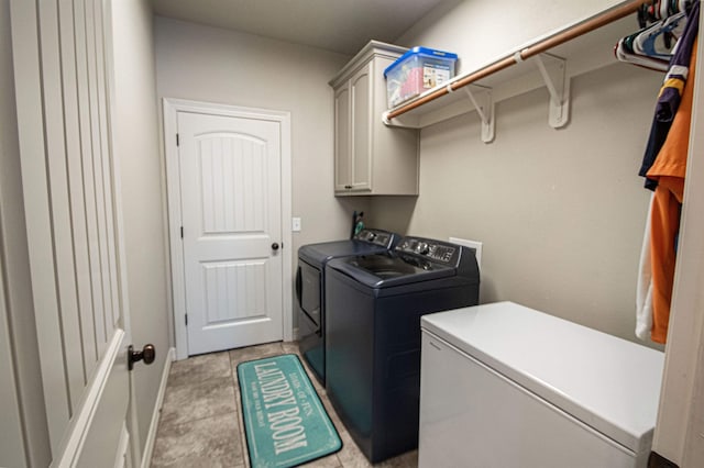 laundry room featuring cabinets and independent washer and dryer