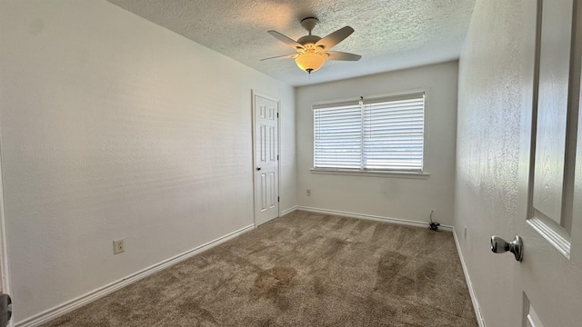 4801 Kent Ave, Groves, TX 77619 - unfurnished room with baseboards, carpet flooring, a ceiling fan, and a textured ceiling