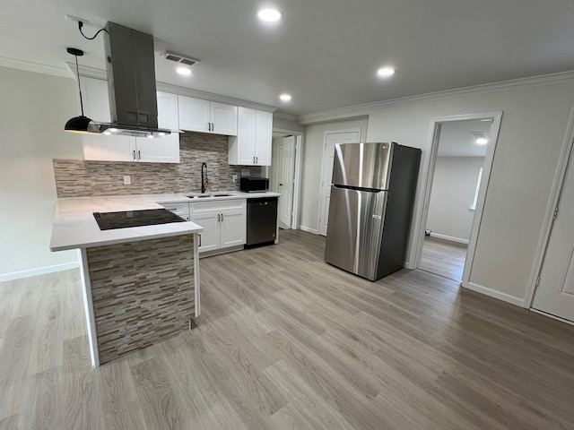 kitchen featuring sink, ventilation hood, pendant lighting, white cabinets, and black appliances