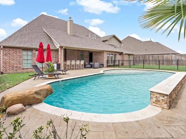 view of swimming pool featuring a patio