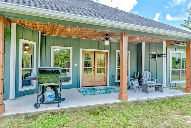 4801 Candlewick Dr, Orange, TX 77630 - doorway to property featuring board and batten siding, roof with shingles, a ceiling fan, french doors, and a patio