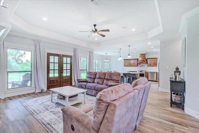 4801 Candlewick Dr, Orange, TX 77630 - living room with a tray ceiling, plenty of natural light, ceiling fan, crown molding, and recessed lighting