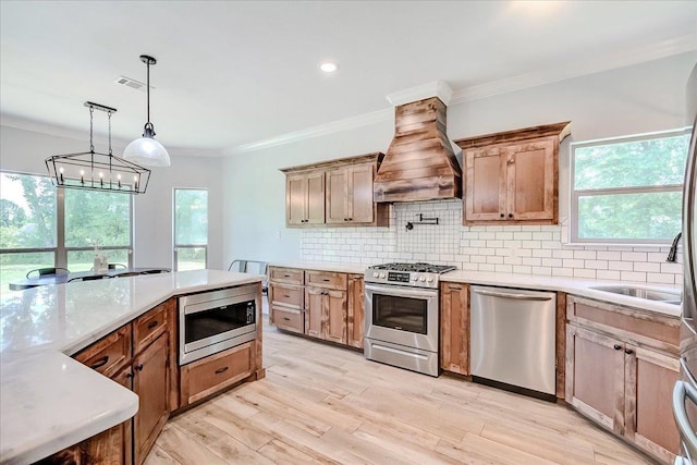 4801 Candlewick Dr, Orange, TX 77630 - kitchen with stainless steel appliances, custom range hood, tasteful backsplash, light countertops, and crown molding