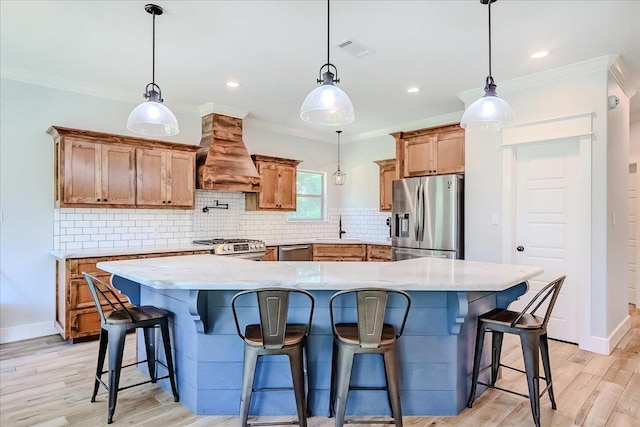 4801 Candlewick Dr, Orange, TX 77630 - kitchen featuring appliances with stainless steel finishes, custom range hood, tasteful backsplash, light wood-style floors, and ornamental molding