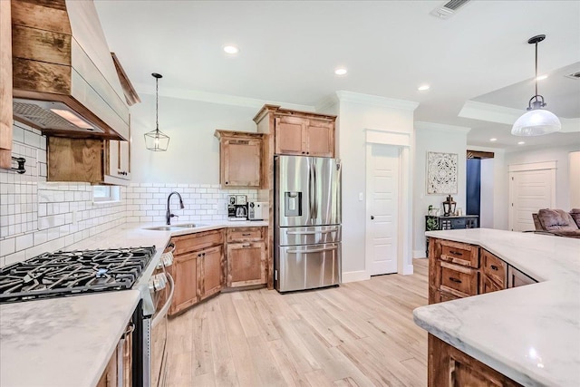 4801 Candlewick Dr, Orange, TX 77630 - kitchen with appliances with stainless steel finishes, ornamental molding, premium range hood, light wood-style flooring, and tasteful backsplash