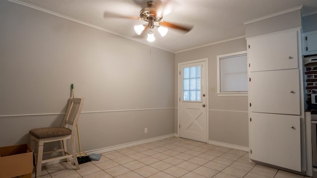 entryway with ceiling fan, light tile patterned floors, and crown molding