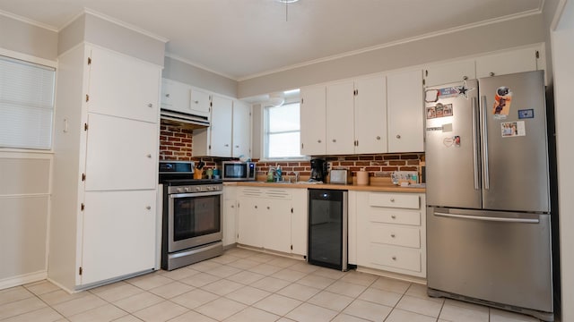 kitchen with decorative backsplash, appliances with stainless steel finishes, wine cooler, ornamental molding, and white cabinetry