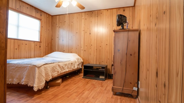 bedroom with ceiling fan and hardwood / wood-style flooring