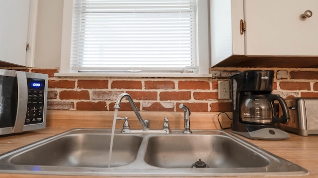 room details with white cabinets and sink