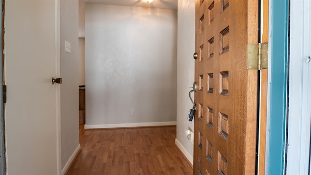 corridor featuring hardwood / wood-style flooring