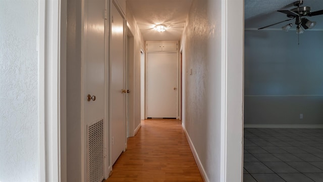 hall with hardwood / wood-style flooring