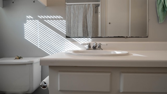 bathroom with vanity and toilet