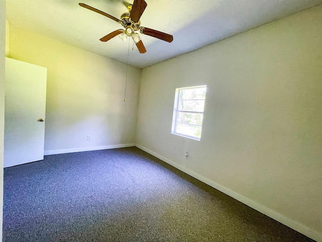 spare room featuring carpet, baseboards, and a ceiling fan
