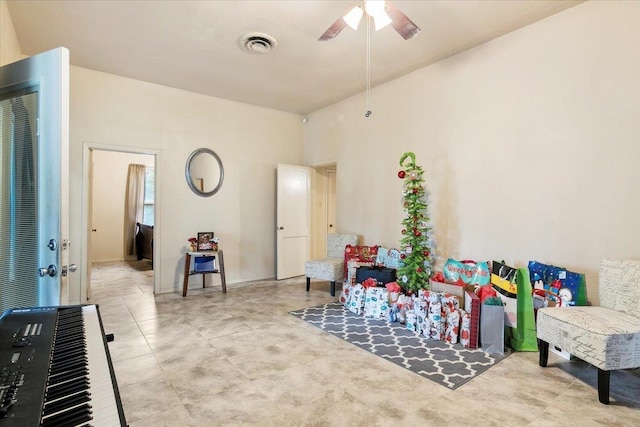 living area with ceiling fan