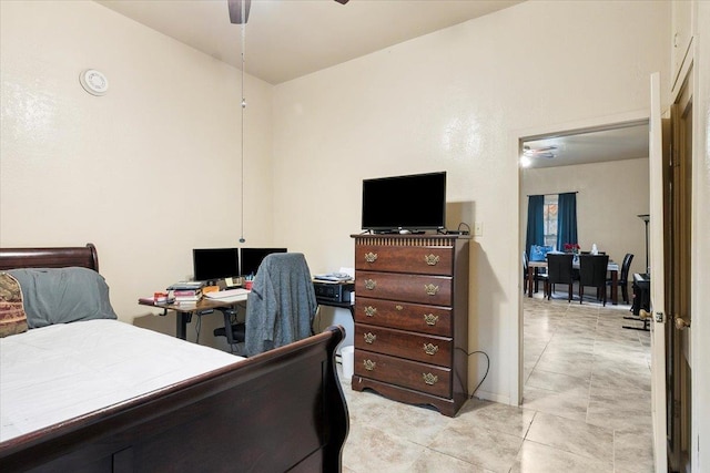 tiled bedroom with ceiling fan