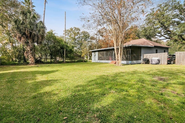 view of yard featuring a sunroom