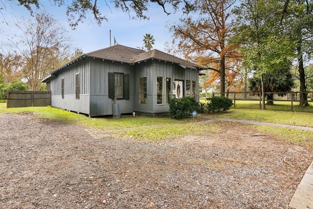 view of home's exterior with a lawn