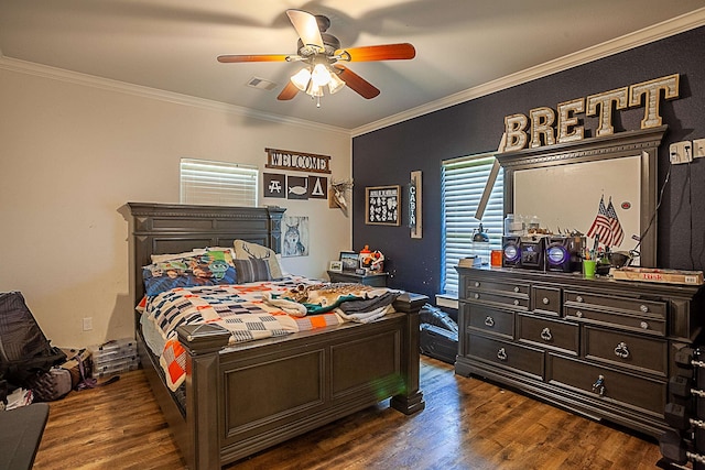 bedroom with ceiling fan, dark wood-type flooring, and ornamental molding