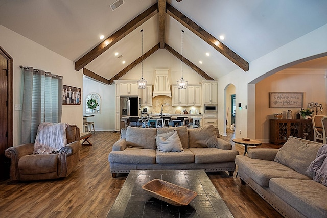 living room with beamed ceiling, dark hardwood / wood-style floors, sink, and high vaulted ceiling