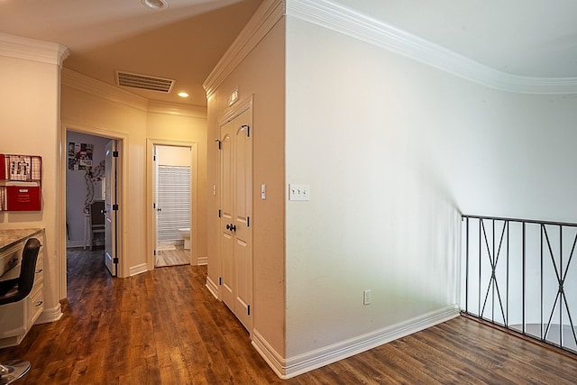 corridor featuring ornamental molding and dark wood-type flooring