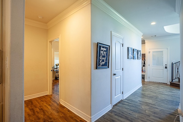 hall featuring dark hardwood / wood-style floors and crown molding