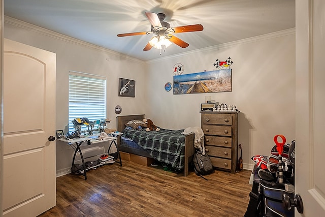 bedroom featuring dark hardwood / wood-style flooring, ceiling fan, and ornamental molding