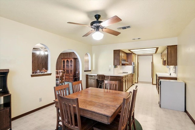 dining space featuring ceiling fan