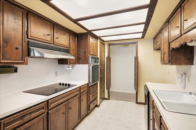 kitchen with black appliances and sink