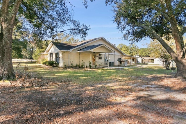 exterior space with a porch and cooling unit