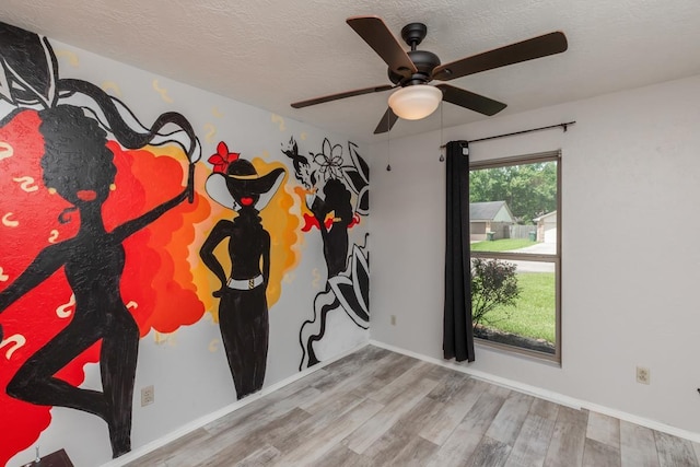 5780 Kristin Ln, Beaumont, TX 77713 - empty room featuring wood finished floors, ceiling fan, and a textured ceiling