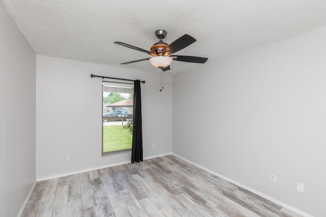 5780 Kristin Ln, Beaumont, TX 77713 - unfurnished room with wood finished floors, a ceiling fan, and a textured ceiling