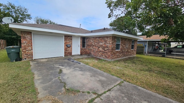 ranch-style home featuring a garage and a front lawn