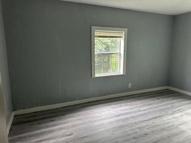 355 Chesser Dr, Vidor, TX 77662 - spare room featuring wood finished floors and baseboards