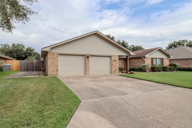 ranch-style house with cooling unit, a garage, and a front lawn