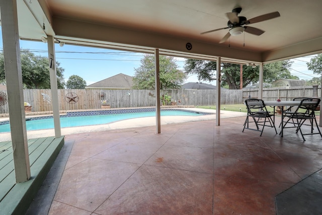 view of pool featuring ceiling fan and a patio area