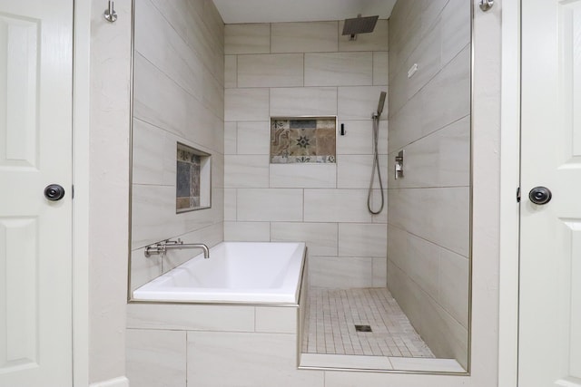 bathroom with separate shower and tub