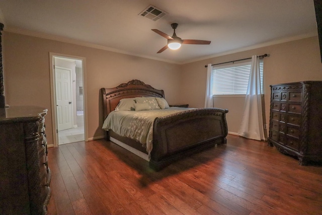 bedroom with ceiling fan, ensuite bathroom, dark wood-type flooring, and ornamental molding