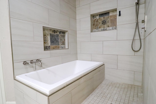 bathroom with a tile shower