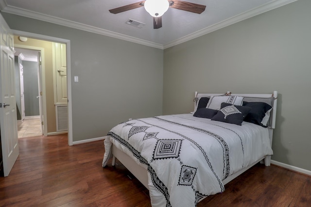 bedroom featuring ceiling fan, dark hardwood / wood-style floors, and ornamental molding