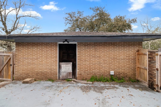 2695 Sandlin St, Beaumont, TX 77707 - view of exterior entry with brick siding and a gate