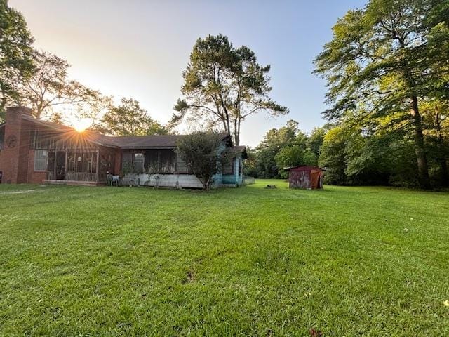 885 E Fm 1943 E, Warren, TX 77664 - view of green lawn featuring a shed