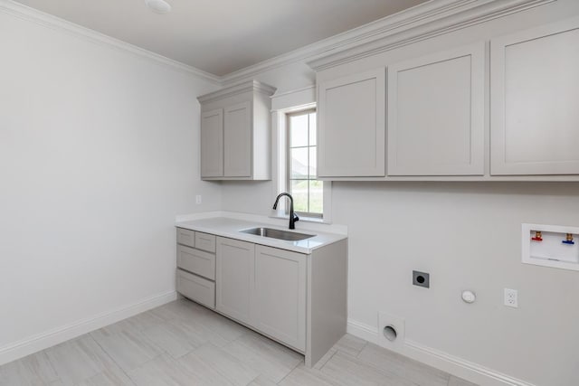 laundry room with baseboards, washer hookup, hookup for an electric dryer, and a sink