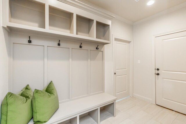 mudroom with recessed lighting and ornamental molding