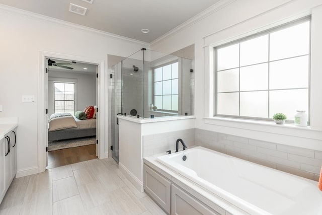 ensuite bathroom featuring a shower stall, visible vents, ornamental molding, a bath, and ensuite bath