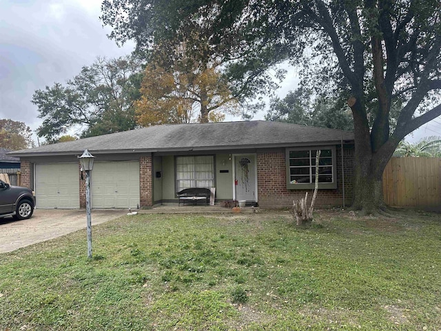 ranch-style home with a garage and a front lawn