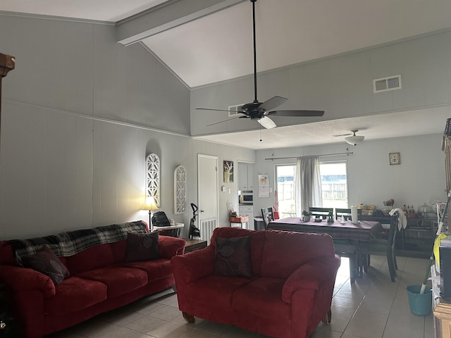 tiled living room featuring vaulted ceiling with beams, ceiling fan, and wooden walls